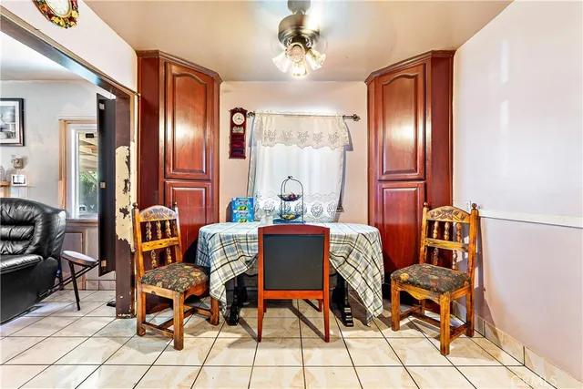 a dining room with furniture and chandelier