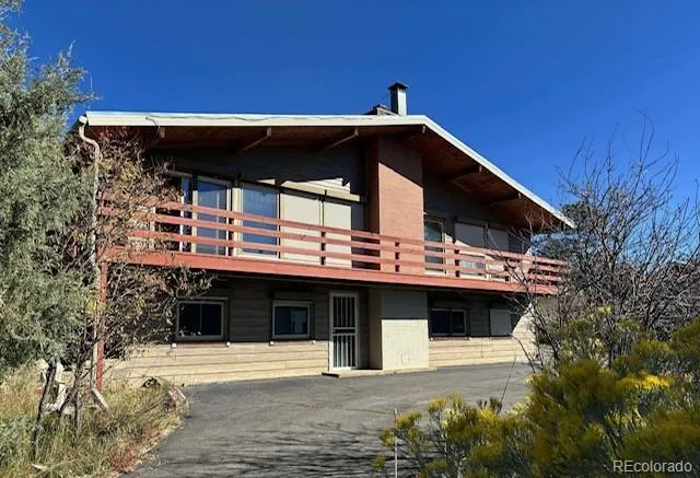 a view of a house with a roof deck