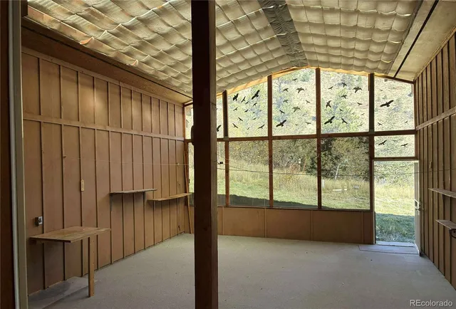 a view of an empty room with a fireplace