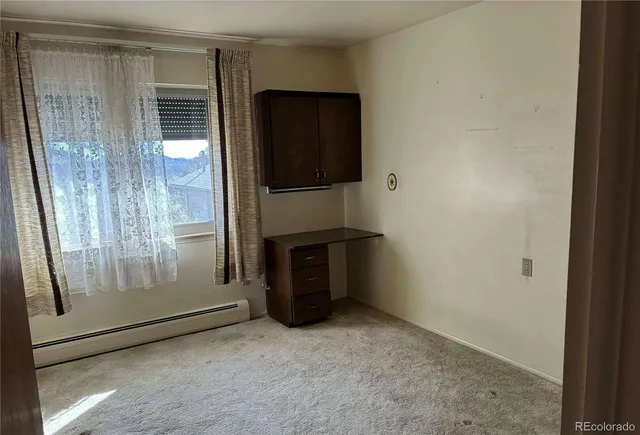 a kitchen with a sink cabinets and stainless steel appliances