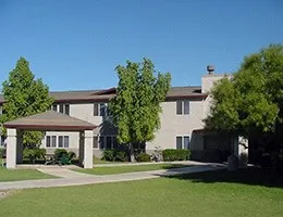 a front view of a house with a yard and a garage
