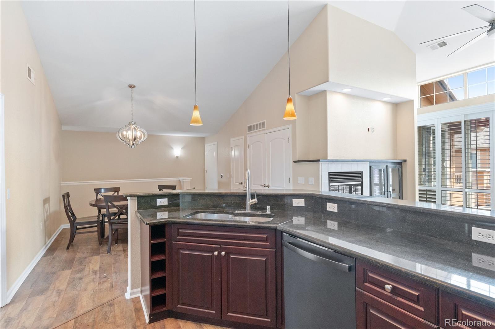 8540 Gold Peak Lane, Unit C Highlands Ranch, CO 80130 - Photo 14 of 37 a kitchen with lots of counter top space and dining table