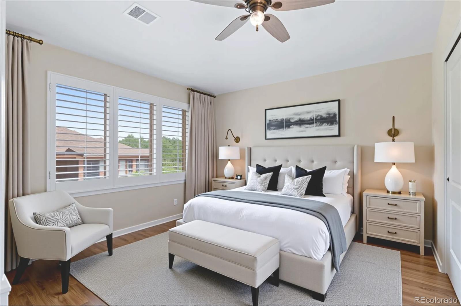 8540 Gold Peak Lane, Unit C Highlands Ranch, CO 80130 - Photo 24 of 37 a bedroom with a bed and a couch