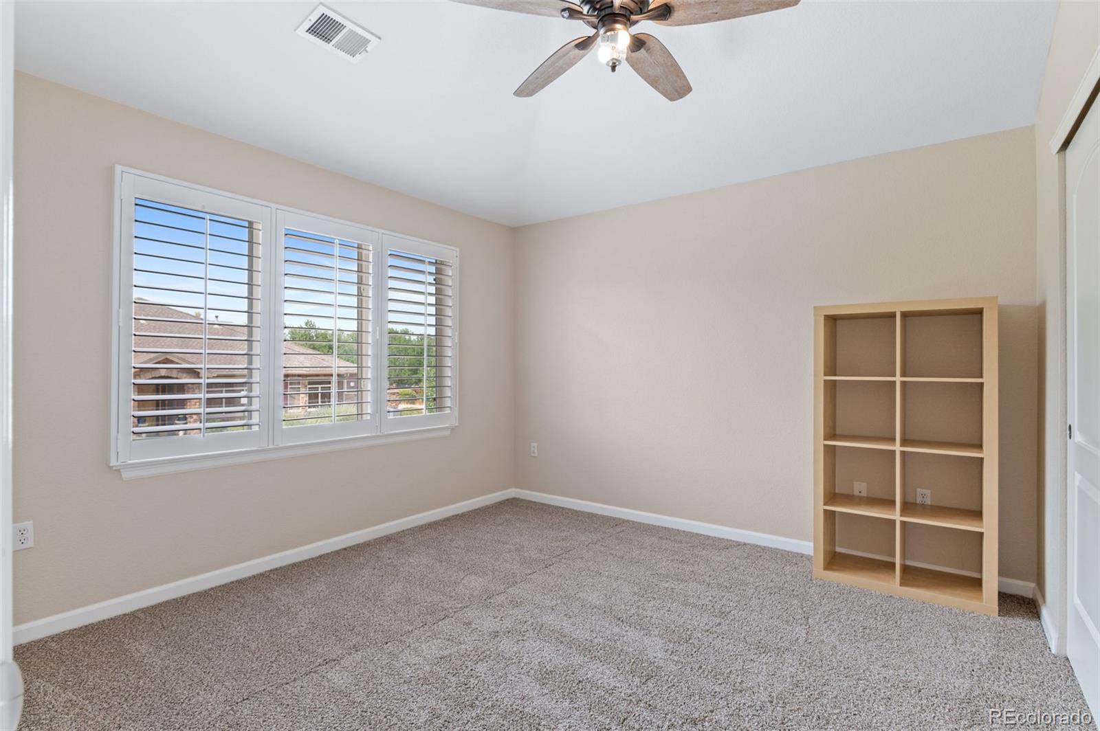 8540 Gold Peak Lane, Unit C Highlands Ranch, CO 80130 - Photo 25 of 37 a view of an empty room with a window