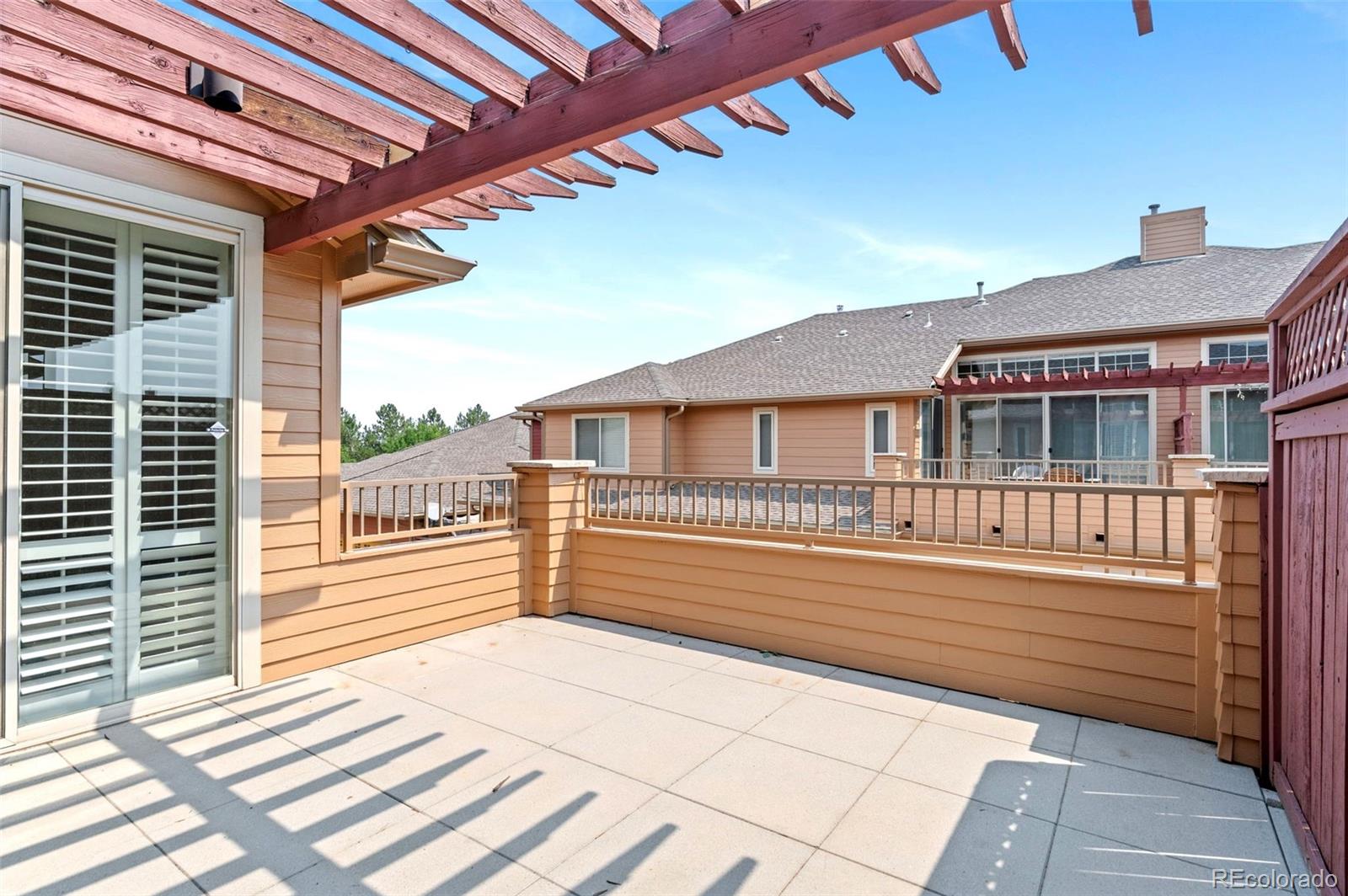 8540 Gold Peak Lane, Unit C Highlands Ranch, CO 80130 - Photo 27 of 37 a view of a wooden deck
