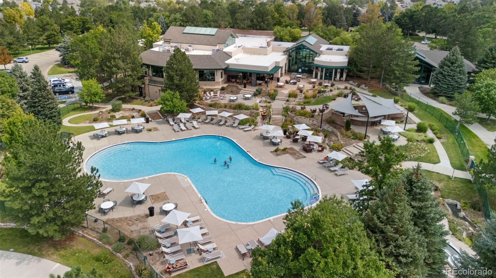 8540 Gold Peak Lane, Unit C Highlands Ranch, CO 80130 - Photo 31 of 37 an aerial view of a house with a swimming pool patio and outdoor seating