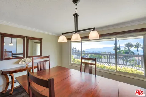 a view of a room that has a bed and a window