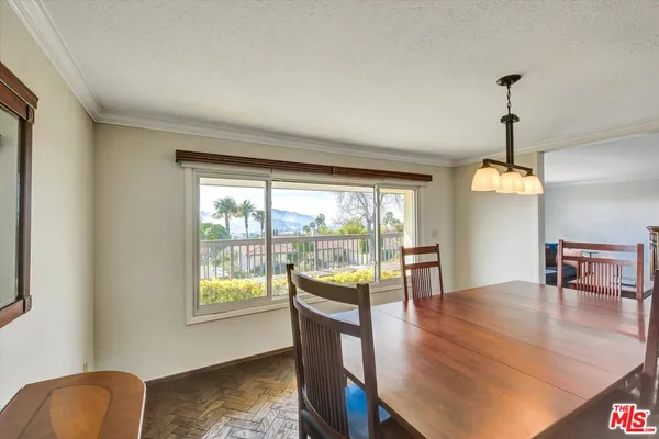 a bedroom with a large bed and a large mirror