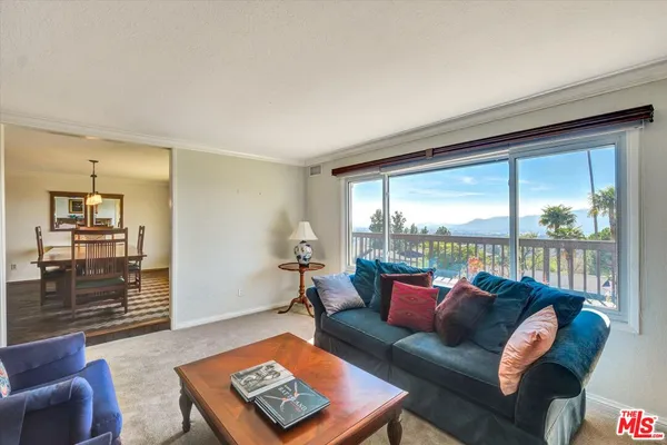 a bathroom with a sink a toilet and a shower curtain
