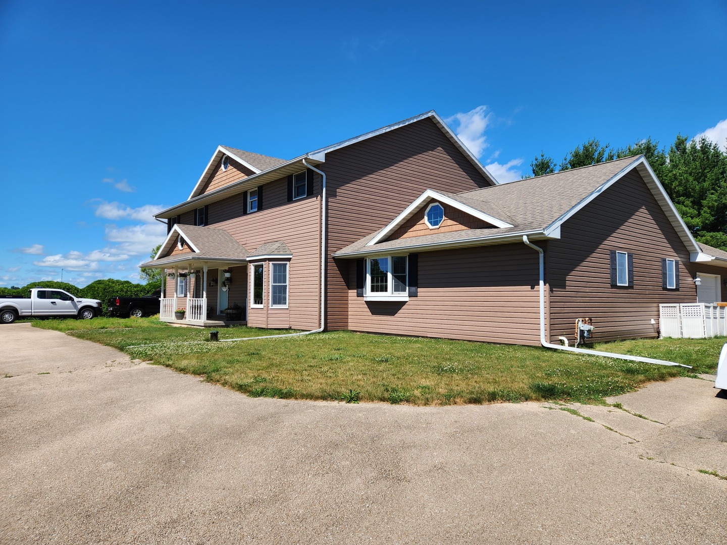 1275 Winn Road Sterling, IL 61081 - Photo 2 of 29 a front view of a house with a yard and garage
