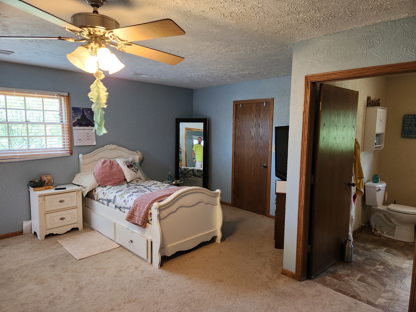 1275 Winn Road Sterling, IL 61081 - Photo 26 of 29 a spacious bedroom with a bed and a chandelier