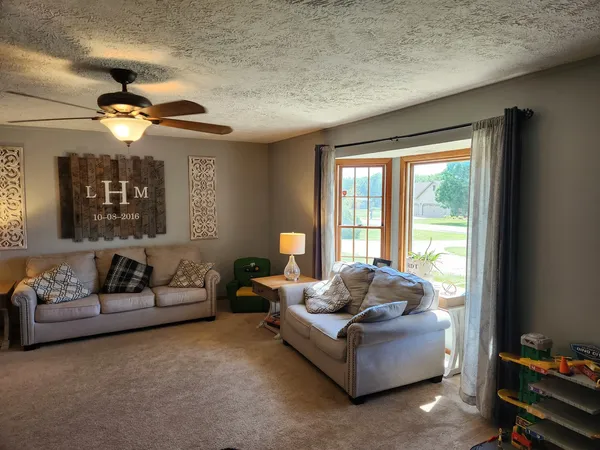 a living room with furniture and a window