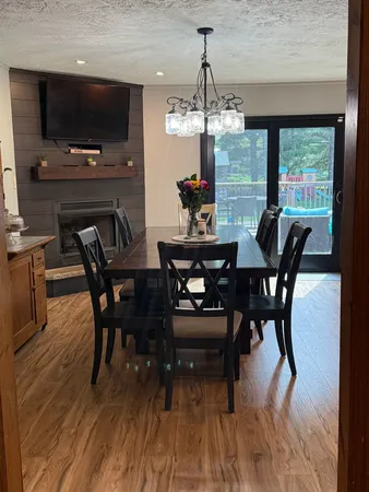 a view of a dining room with furniture window and outside view