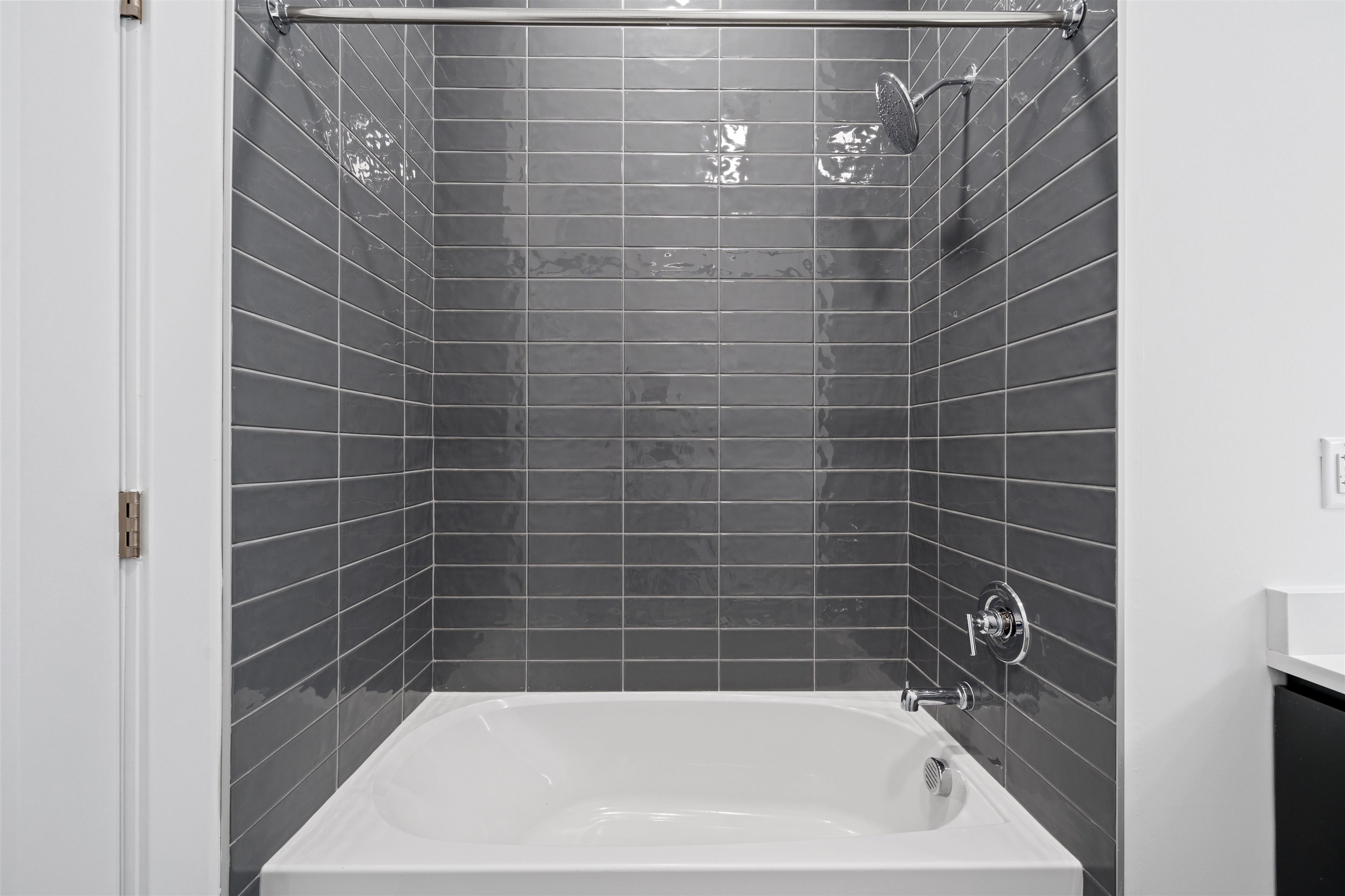 17 Ave East, Unit 504 Bayonne, NJ 07002 - Photo 14 of 30 a bathroom with a bathtub