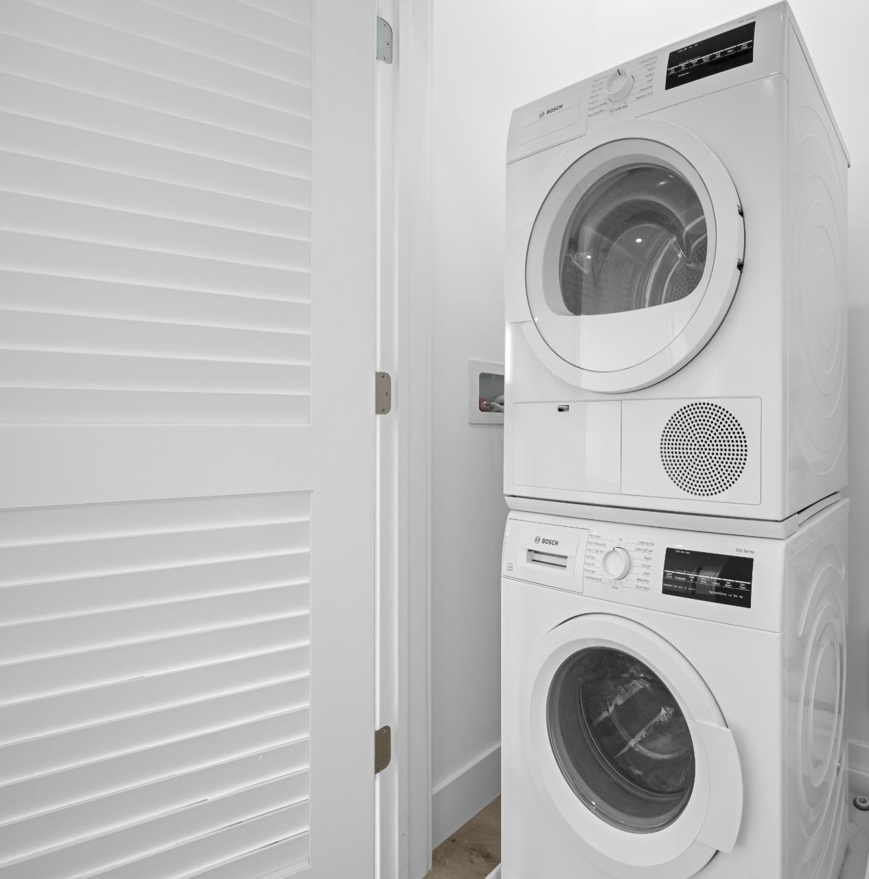 17 Ave East, Unit 504 Bayonne, NJ 07002 - Photo 15 of 30 a utility room with dryer and washer