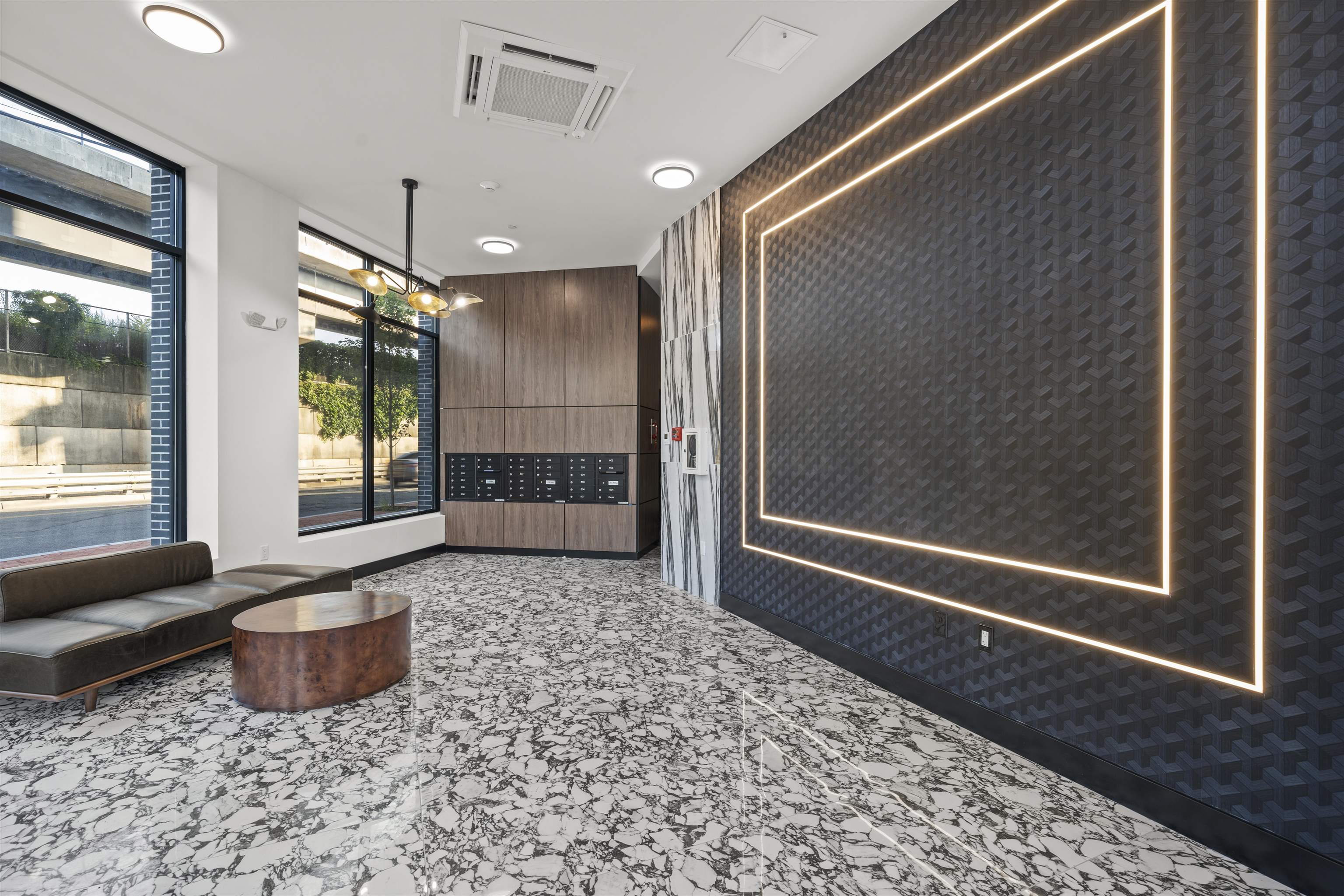 17 Ave East, Unit 504 Bayonne, NJ 07002 - Photo 17 of 30 a living room with a couch and a table