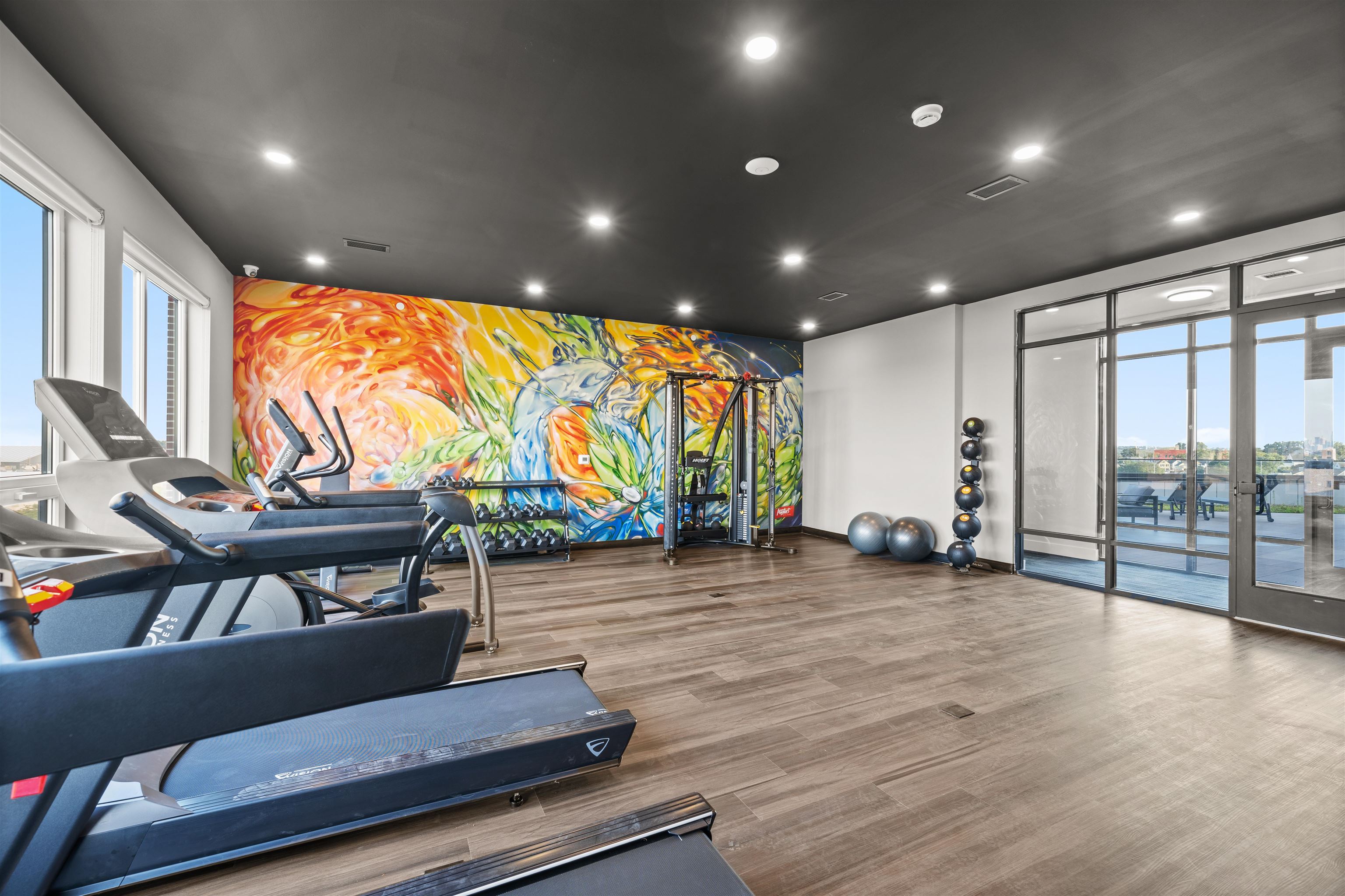 17 Ave East, Unit 504 Bayonne, NJ 07002 - Photo 20 of 30 a living room with furniture a rug and a large window