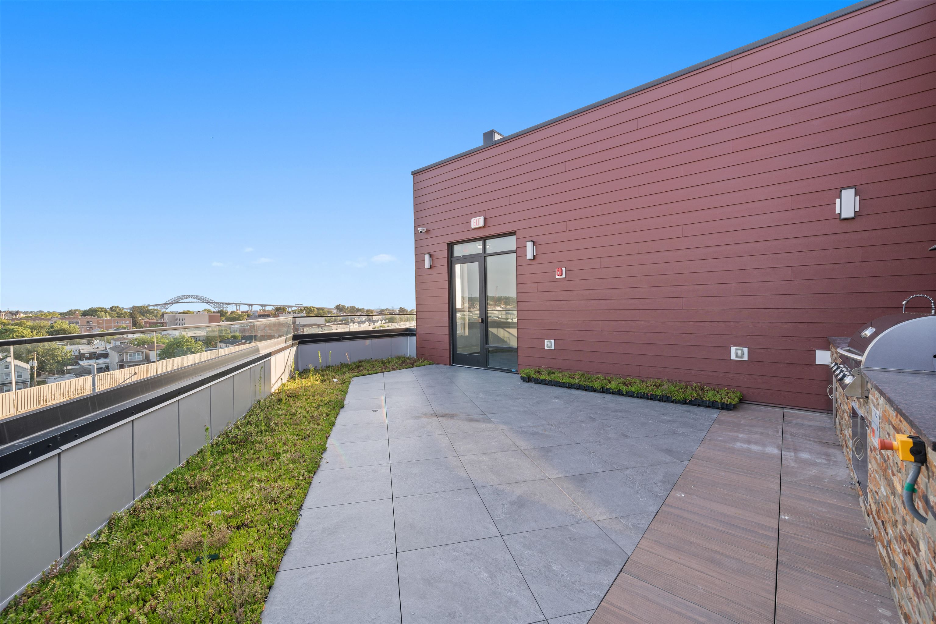 17 Ave East, Unit 504 Bayonne, NJ 07002 - Photo 23 of 30 a view of a terrace with a garden