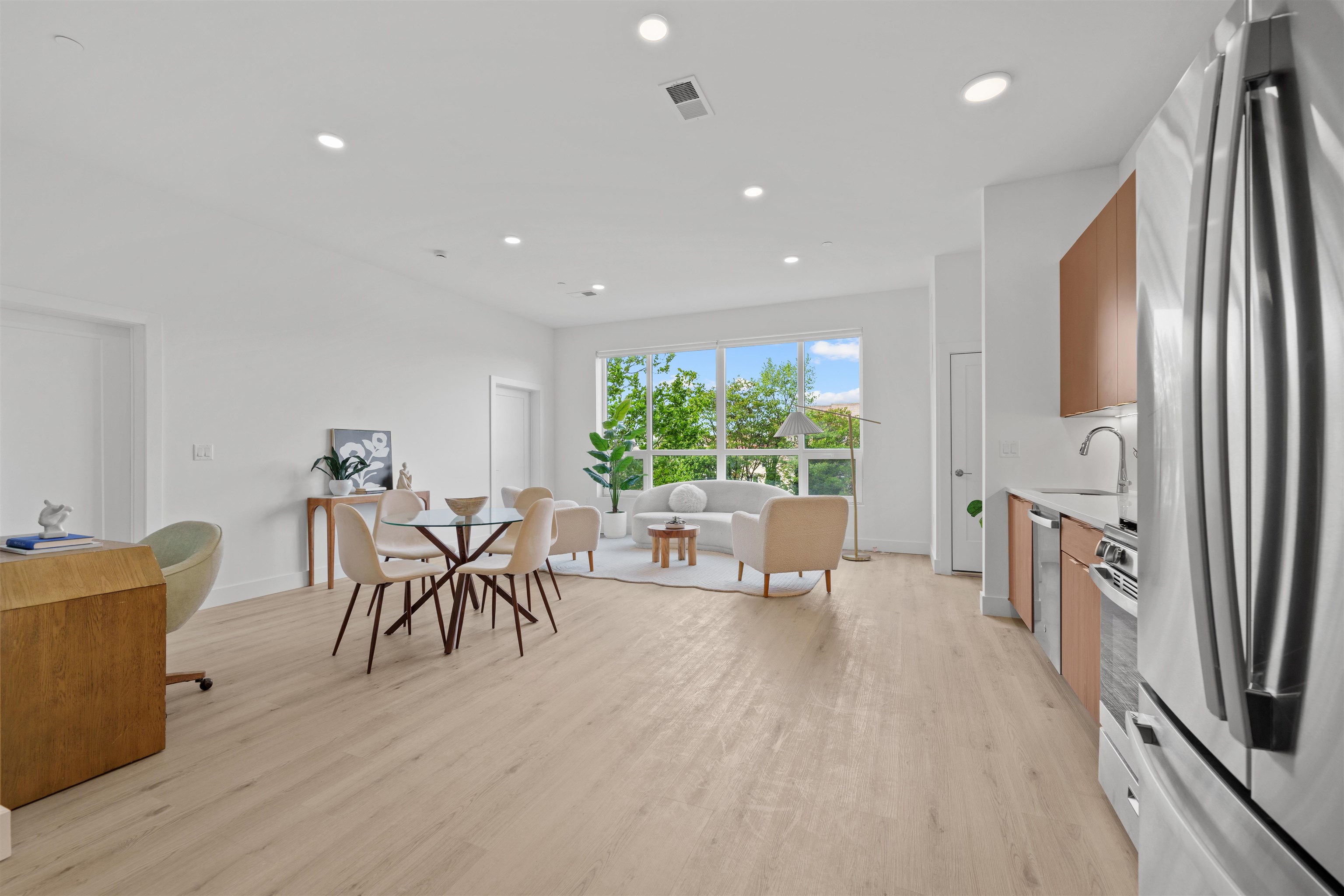17 Ave East, Unit 504 Bayonne, NJ 07002 - Photo 3 of 30 a living room with furniture and a large window