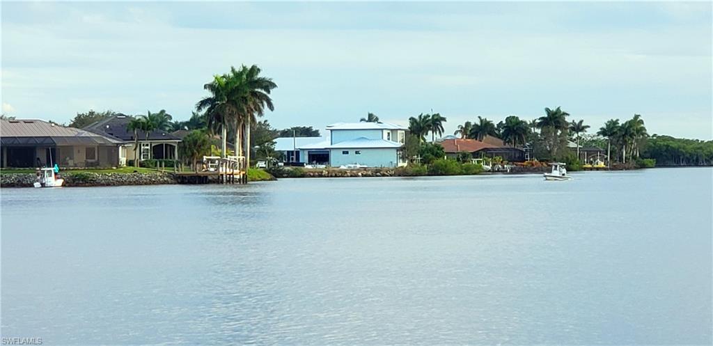 149 Venus Cay Naples, FL 34114 - Photo 14 of 21 a front view of multiple houses with yard