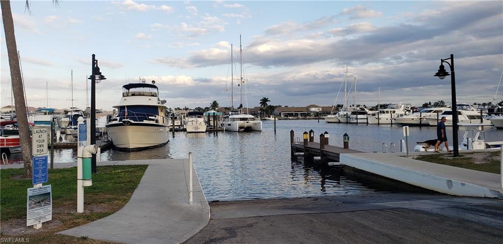 149 Venus Cay Naples, FL 34114 - Photo 15 of 21 a lake view with water view and boat