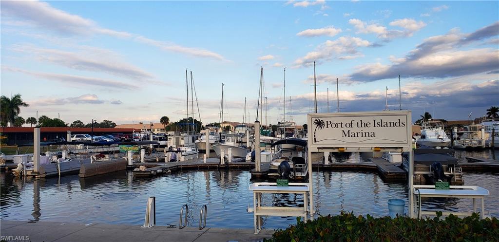 149 Venus Cay Naples, FL 34114 - Photo 16 of 21 a view of a water fountain and a floor to ceiling window