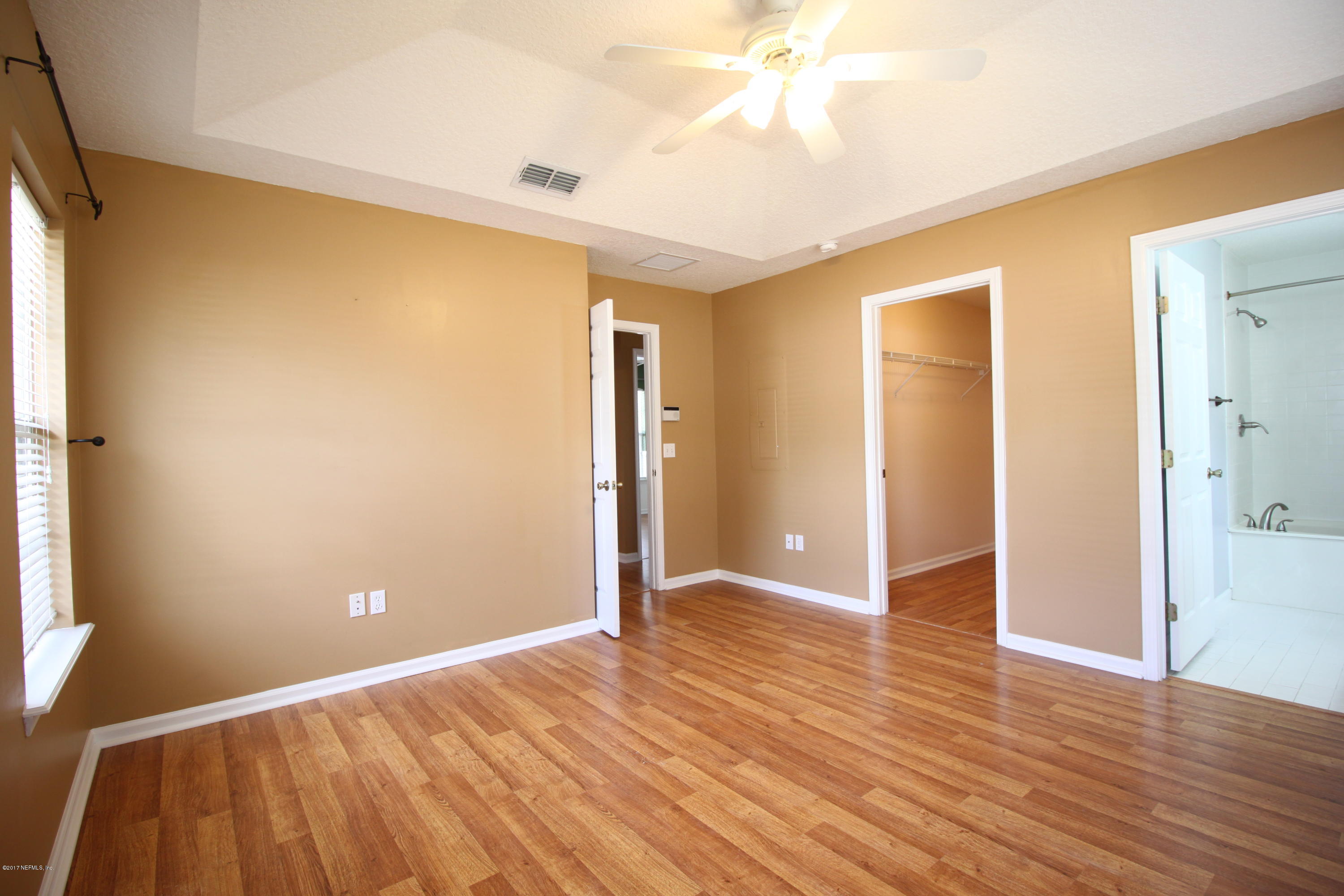 54303 Cravey Road Callahan, FL 32011 - Photo 11 of 13 a view of an empty room with wooden floor
