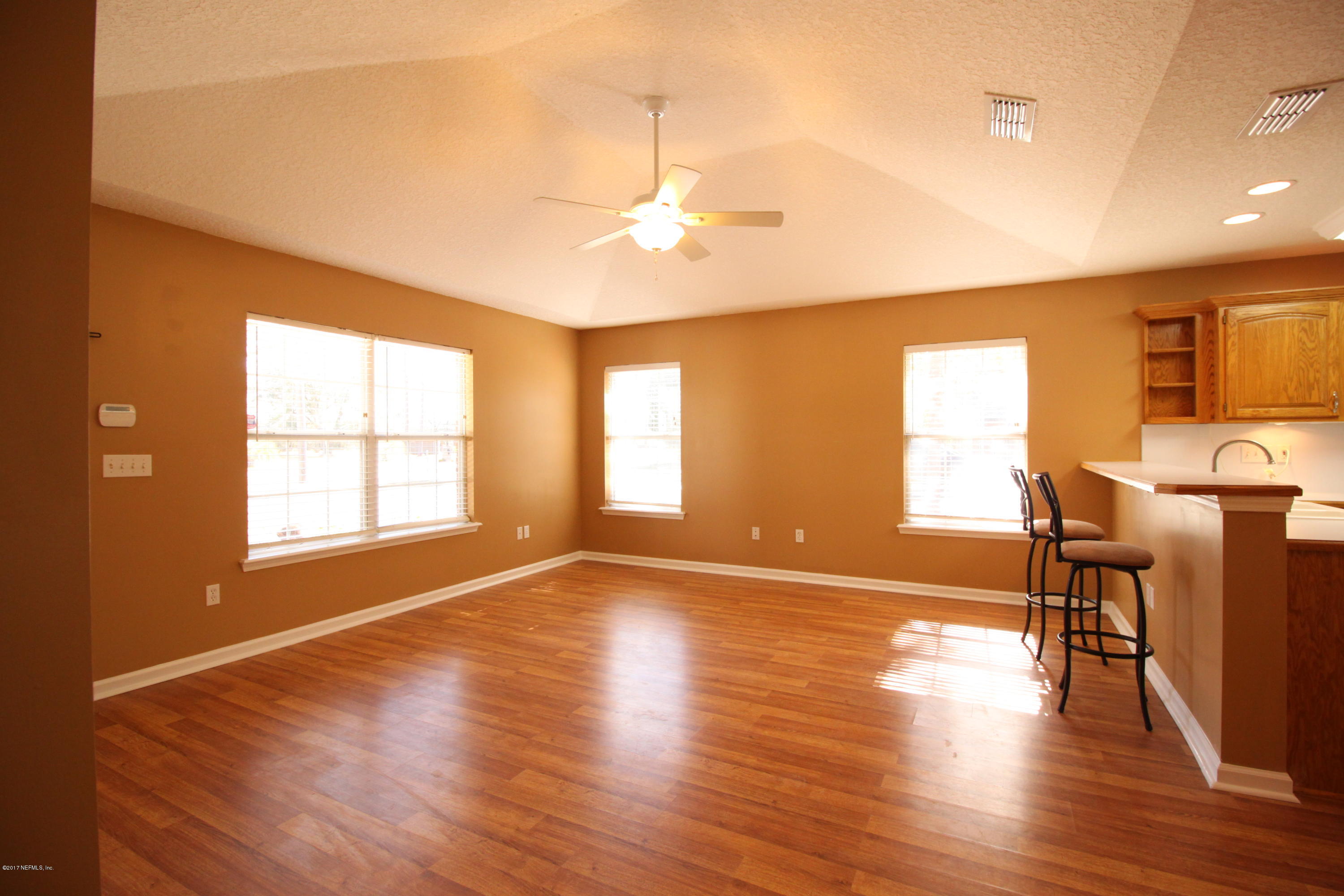 54303 Cravey Road Callahan, FL 32011 - Photo 4 of 13 a view of a livingroom with furniture window and wooden floor