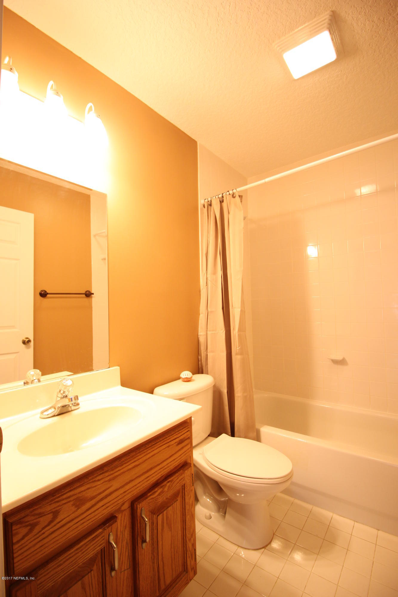 54303 Cravey Road Callahan, FL 32011 - Photo 9 of 13 a bathroom with a sink a toilet and shower