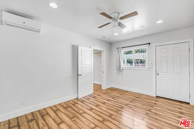 a bedroom with a bed and a view of bathroom