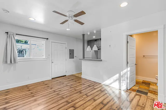 a view of kitchen with furniture and wooden floor