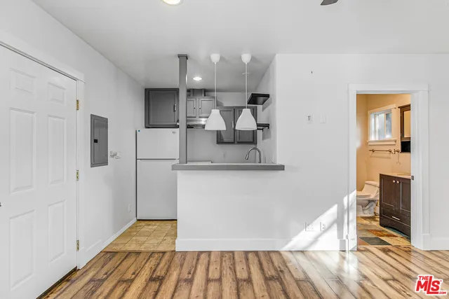 a kitchen with a sink and a microwave