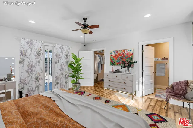 a bedroom with furniture and a chandelier