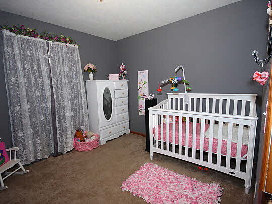 11601 East Kyte Road Rochelle, IL 61068 - Photo 7 of 11 a bedroom with furniture and a window