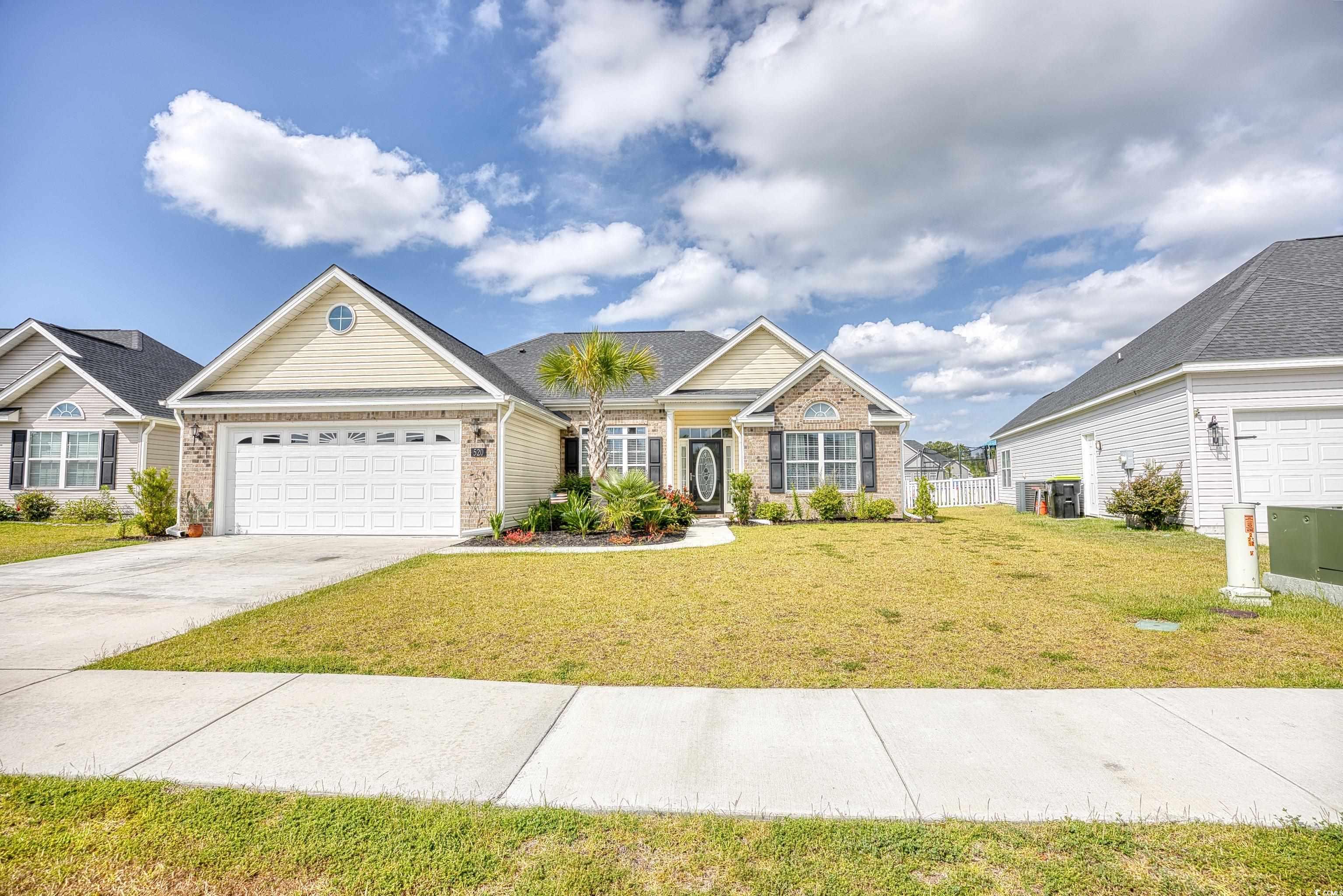 520 Hobie Cat Road Myrtle Beach, SC 29588 - Photo 1 of 40 View of front of home with a garage and a front la