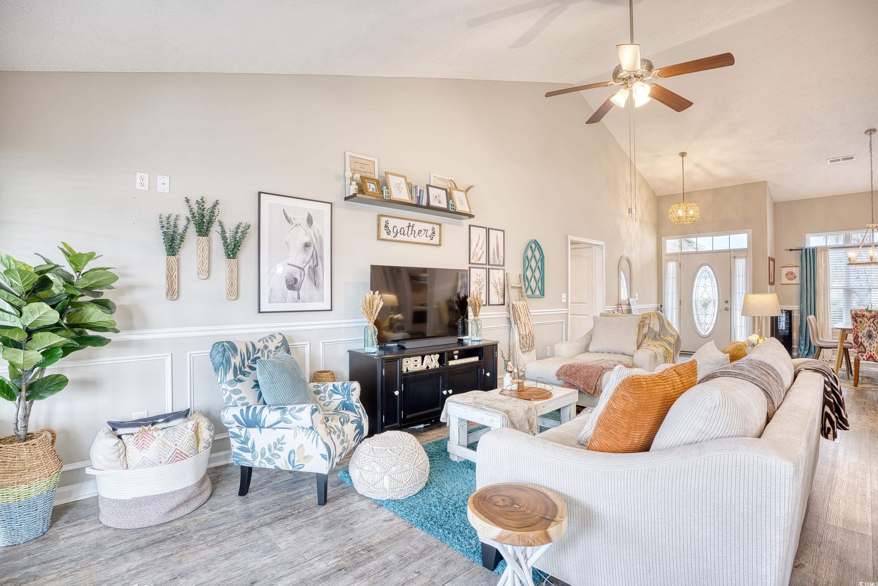 520 Hobie Cat Road Myrtle Beach, SC 29588 - Photo 11 of 40 Living room featuring vaulted ceiling, ceiling fan