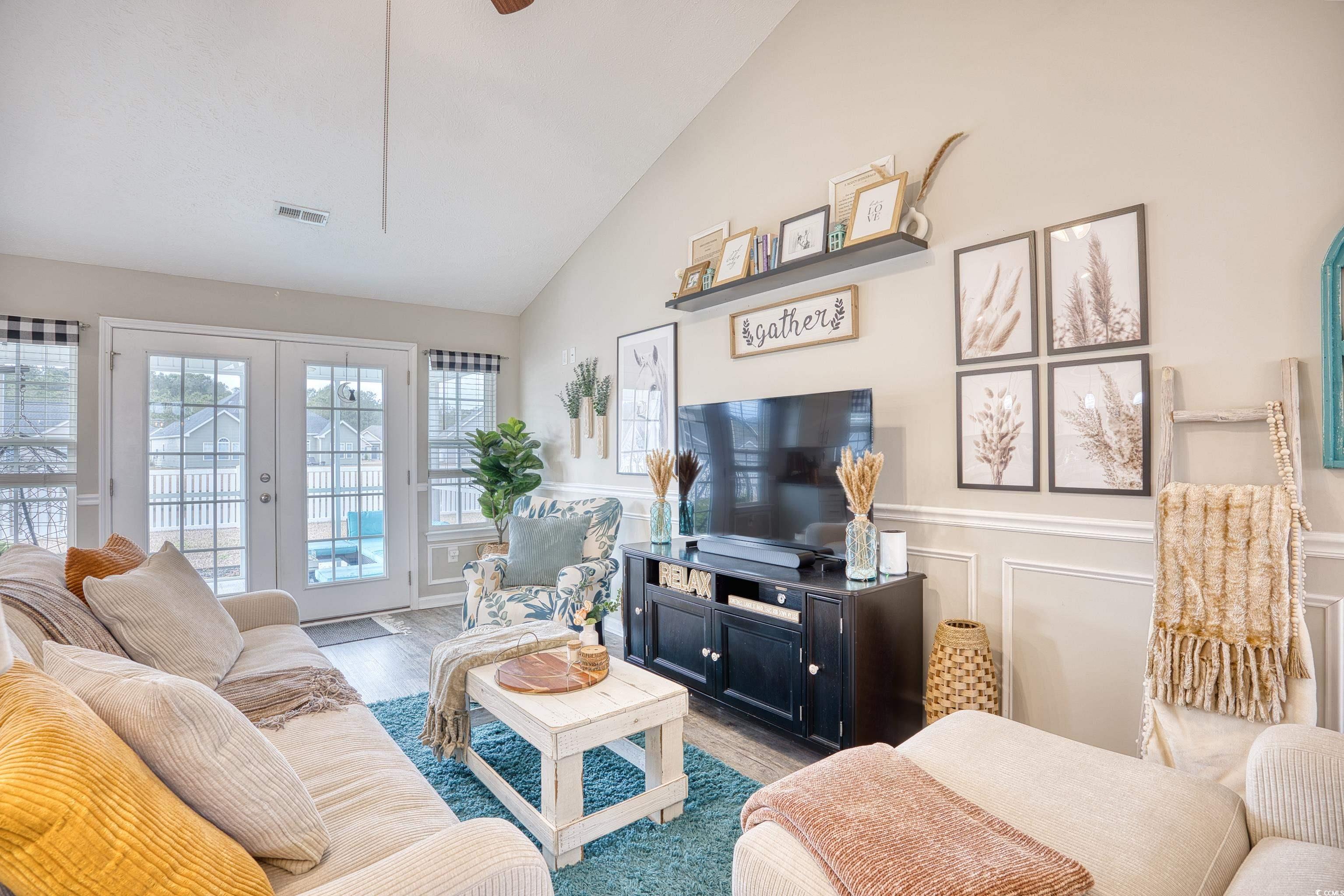 520 Hobie Cat Road Myrtle Beach, SC 29588 - Photo 12 of 40 Living room with french doors, lofted ceiling, and