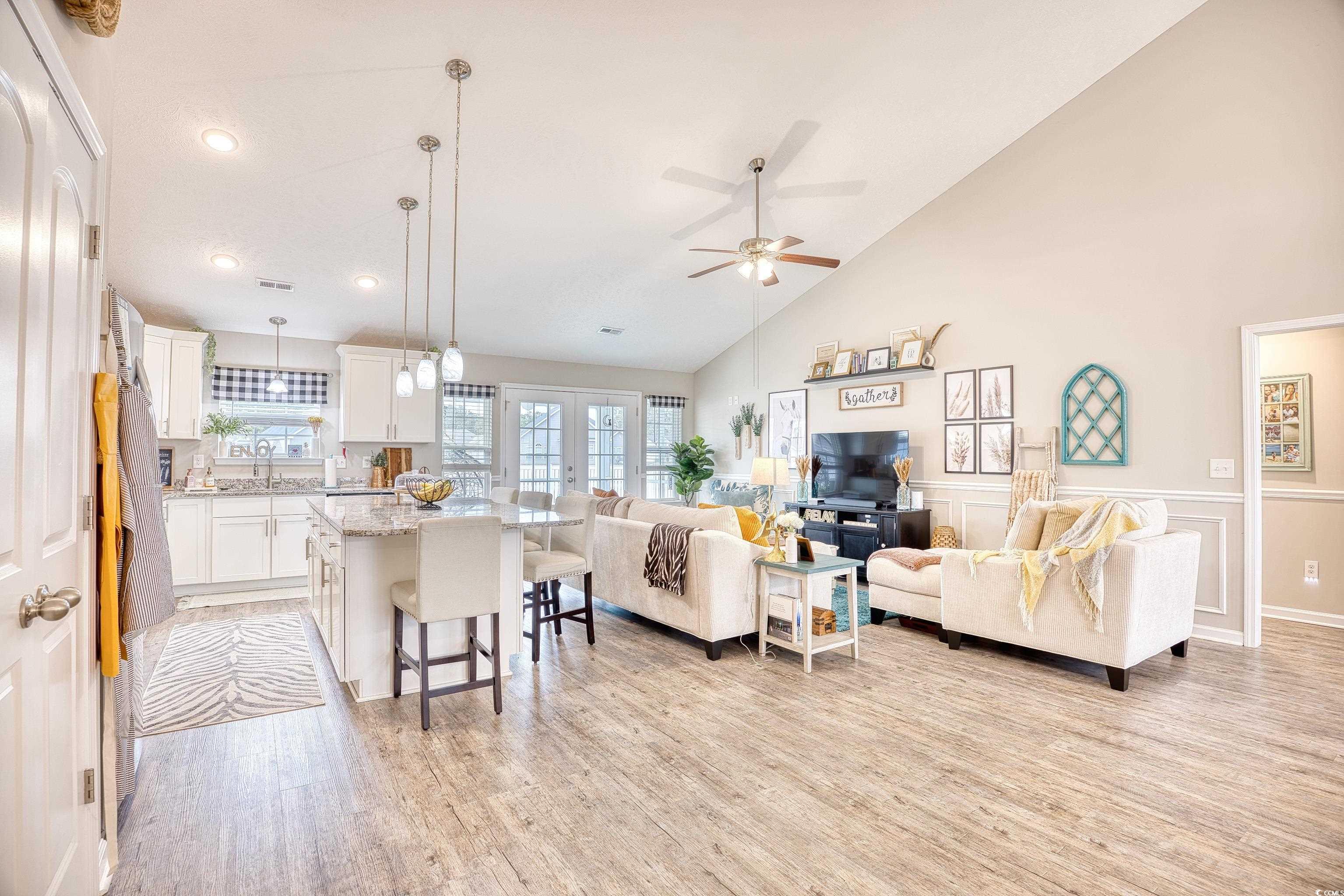520 Hobie Cat Road Myrtle Beach, SC 29588 - Photo 13 of 40 Living room with french doors, high vaulted ceilin