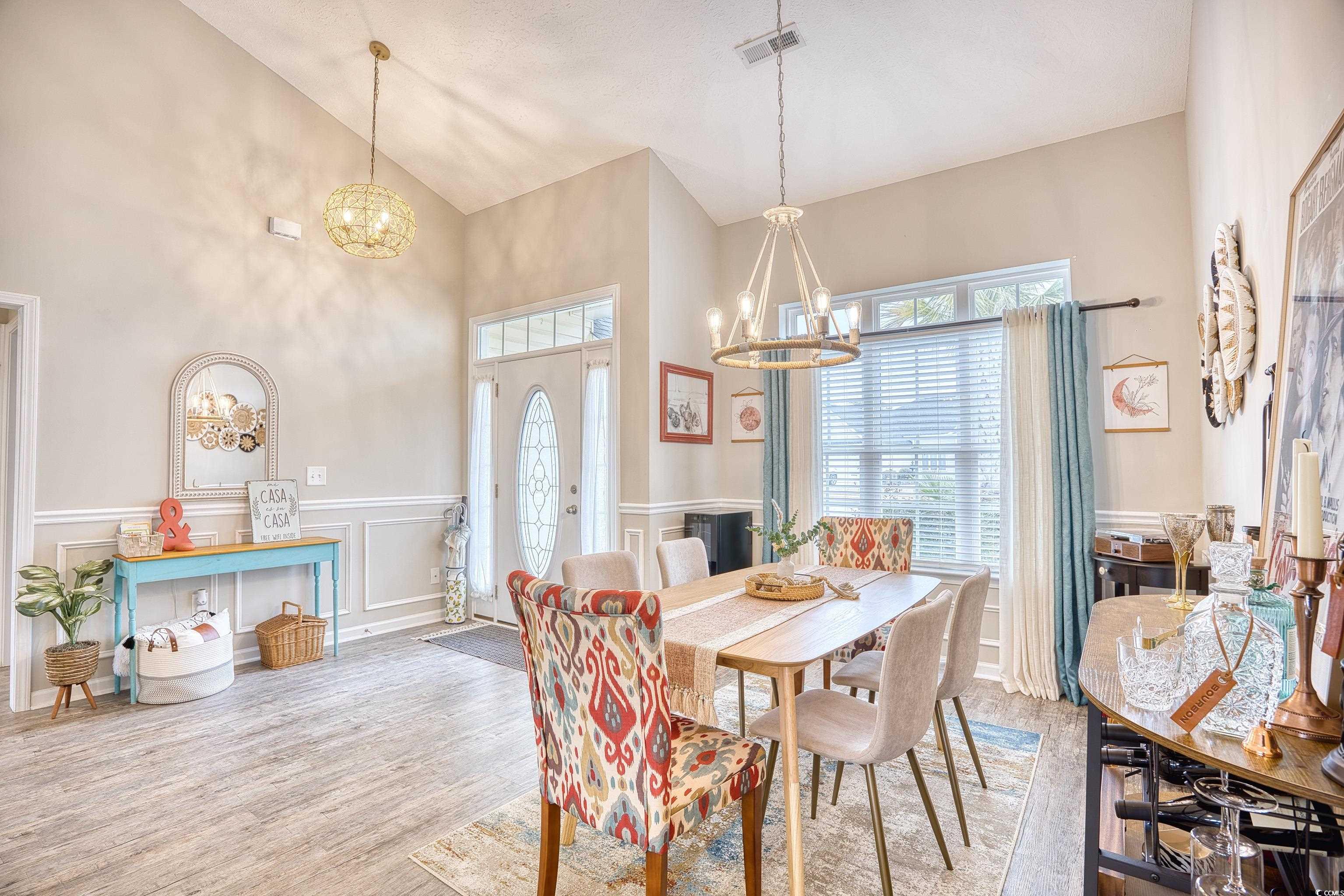520 Hobie Cat Road Myrtle Beach, SC 29588 - Photo 15 of 40 Dining area featuring high vaulted ceiling, light