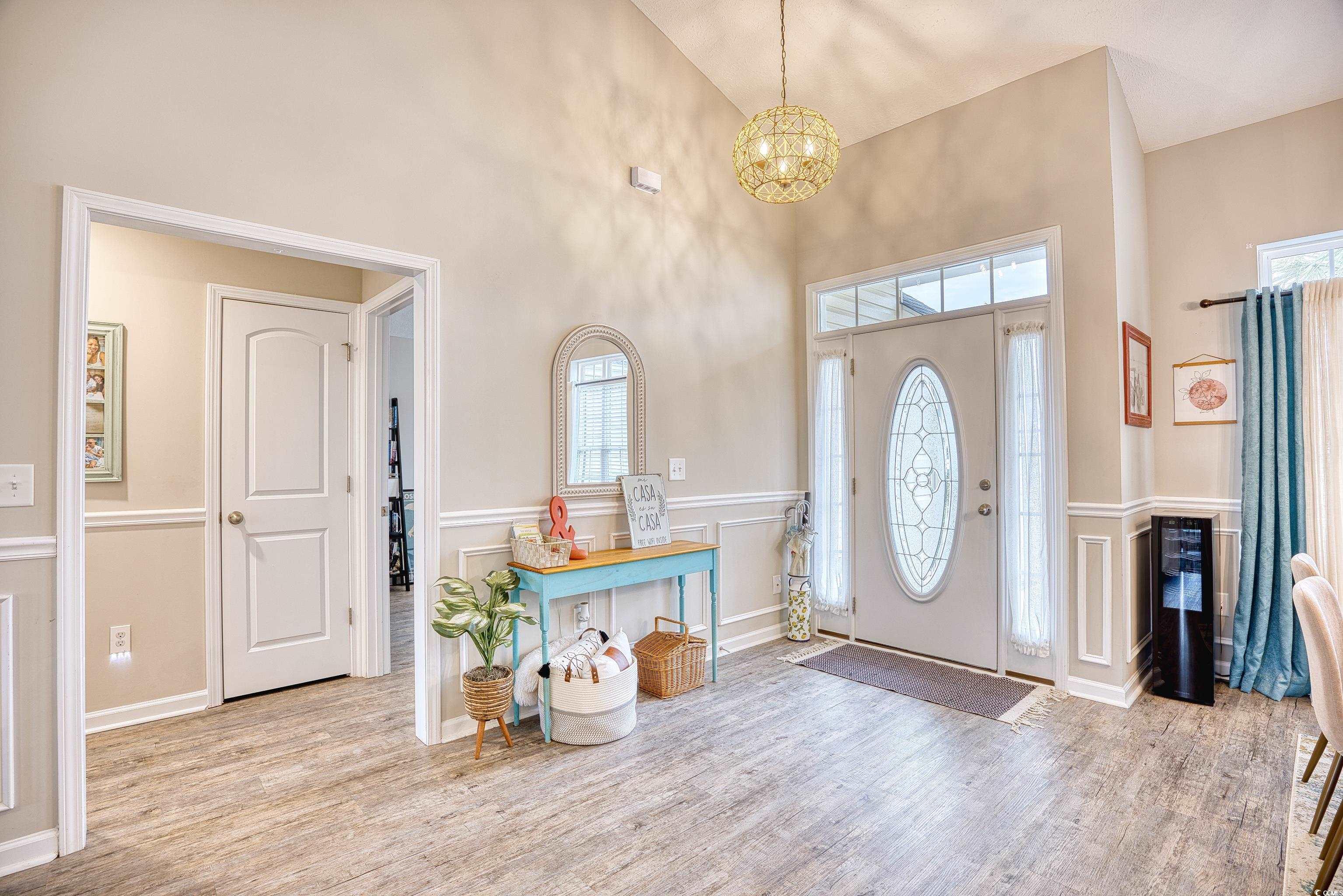 520 Hobie Cat Road Myrtle Beach, SC 29588 - Photo 2 of 40 Foyer with high vaulted ceiling, light hardwood /