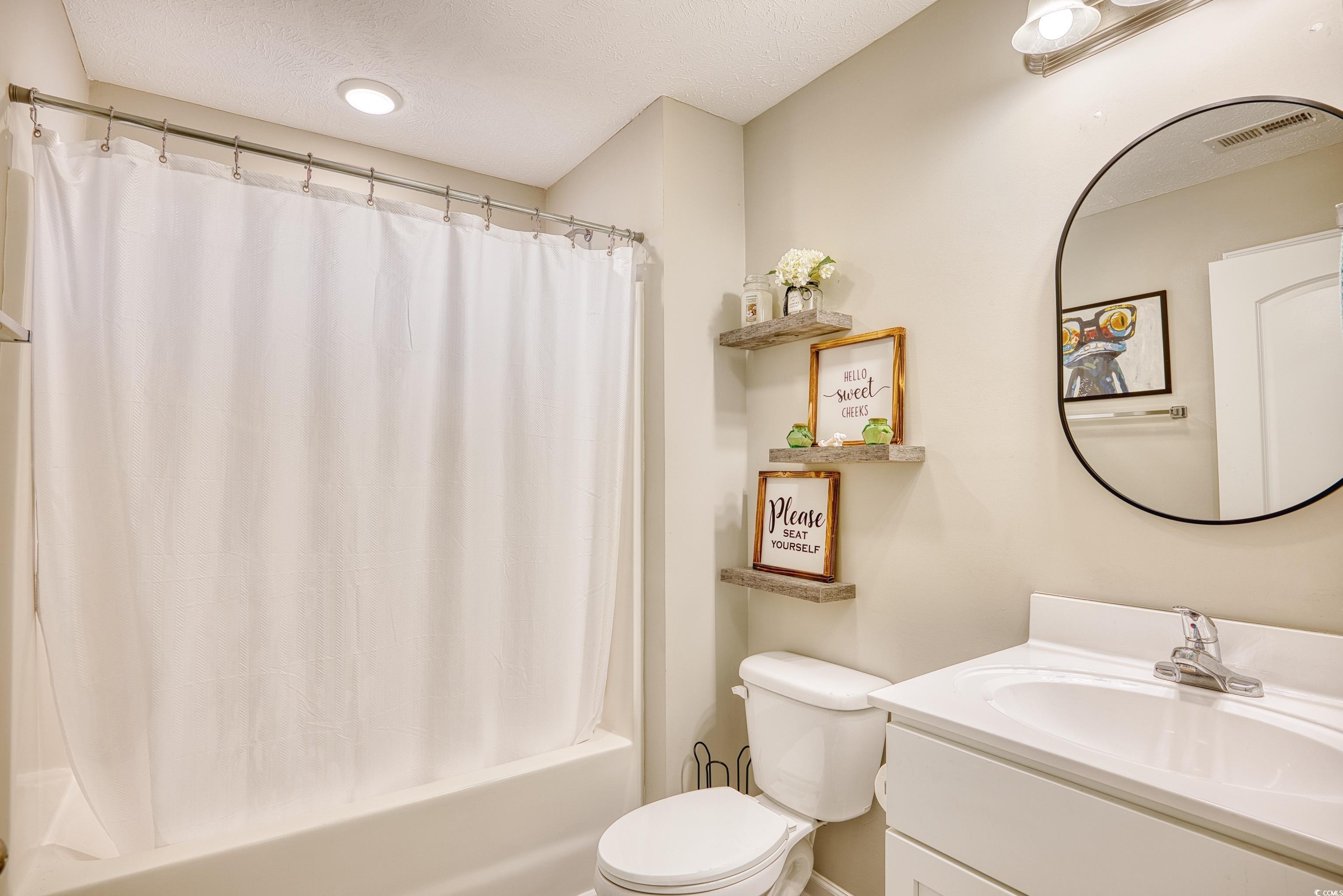 520 Hobie Cat Road Myrtle Beach, SC 29588 - Photo 24 of 40 Full bathroom with toilet, a textured ceiling, sho