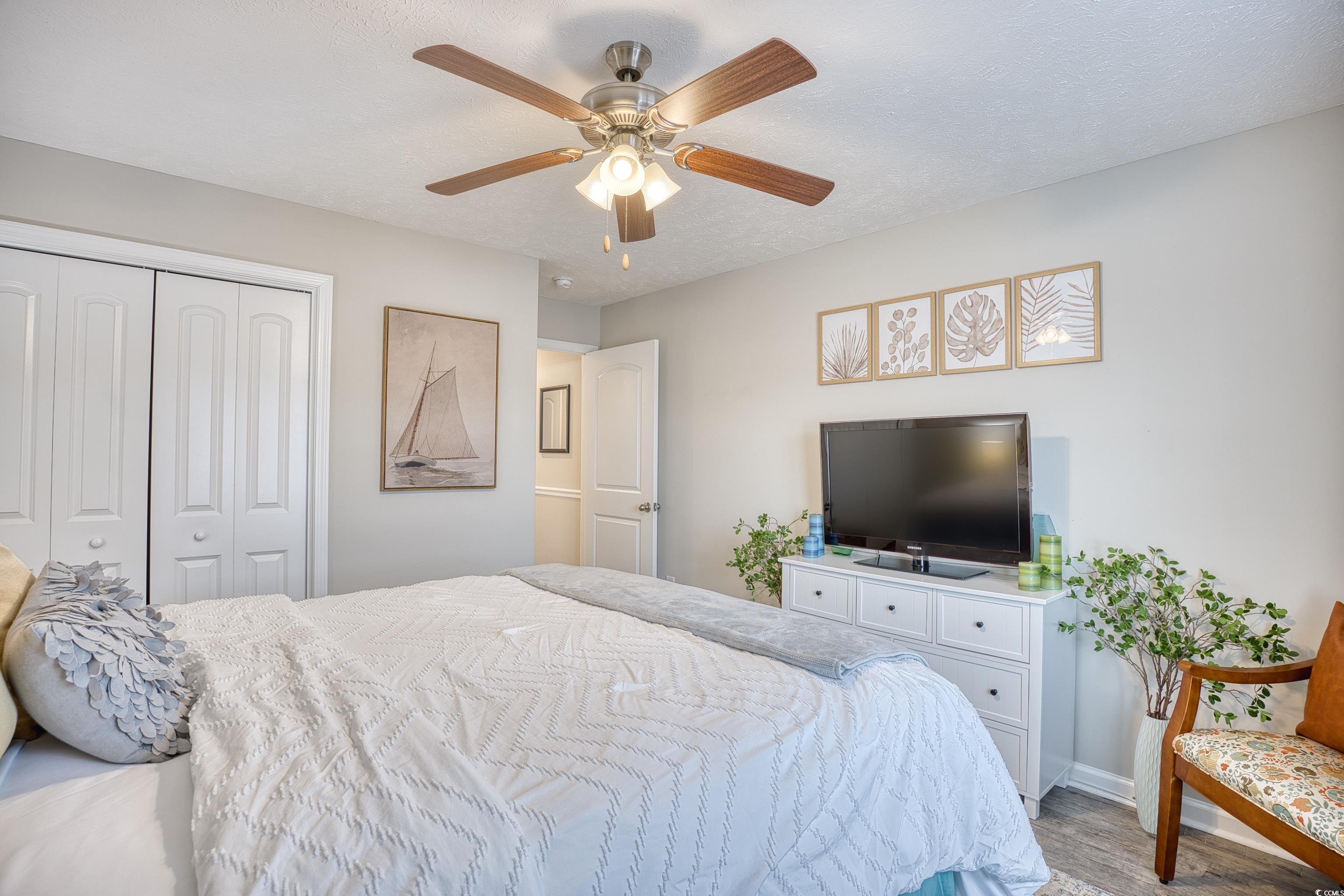 520 Hobie Cat Road Myrtle Beach, SC 29588 - Photo 28 of 40 Bedroom with ceiling fan, hardwood / wood-style fl