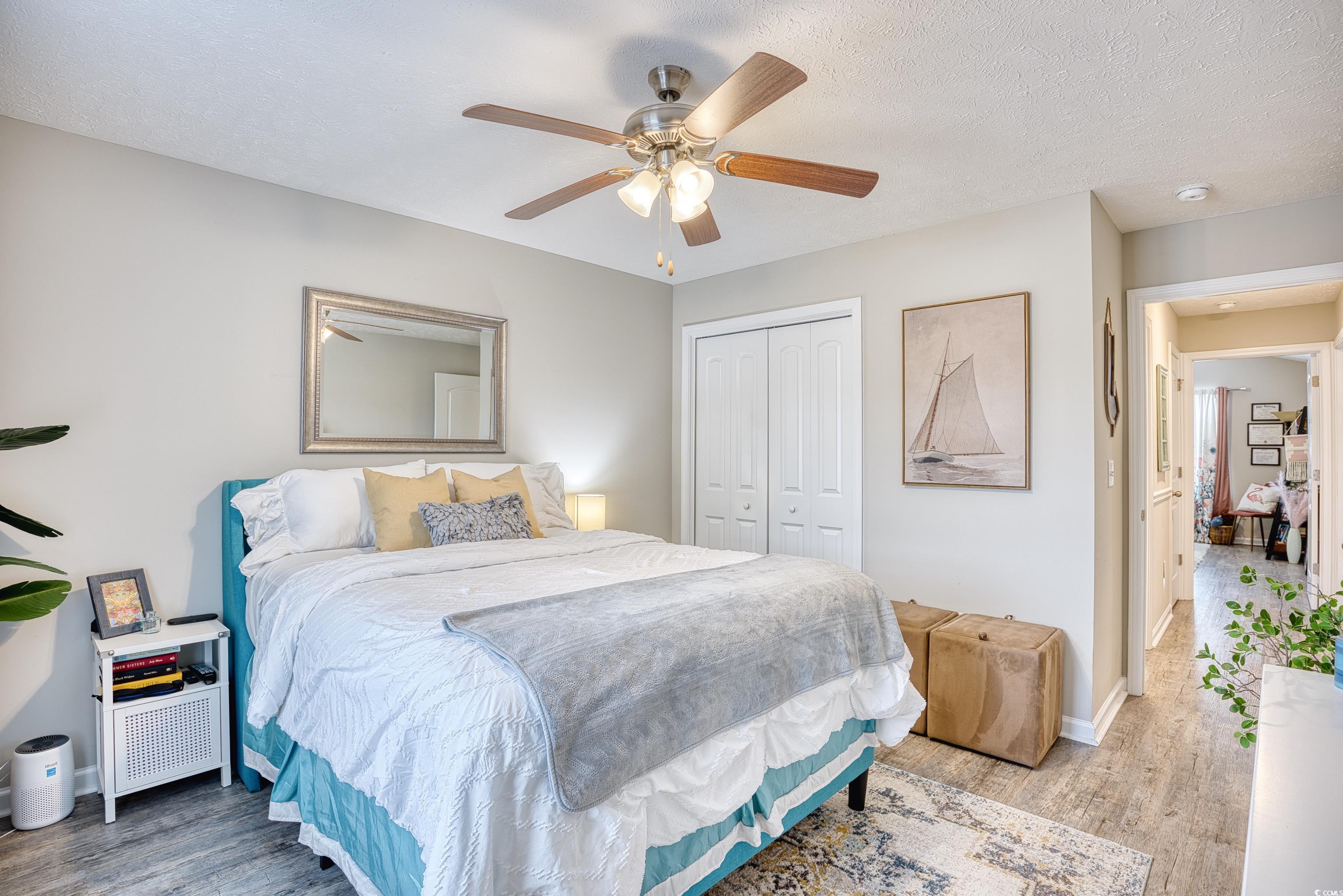 520 Hobie Cat Road Myrtle Beach, SC 29588 - Photo 29 of 40 Bedroom featuring a textured ceiling, ceiling fan,