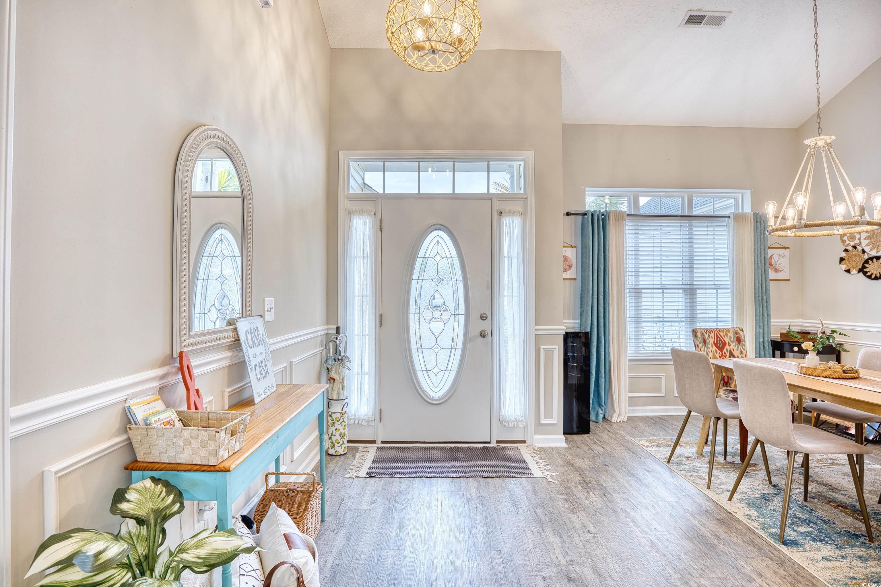 520 Hobie Cat Road Myrtle Beach, SC 29588 - Photo 3 of 40 Entryway with a high ceiling, an inviting chandeli