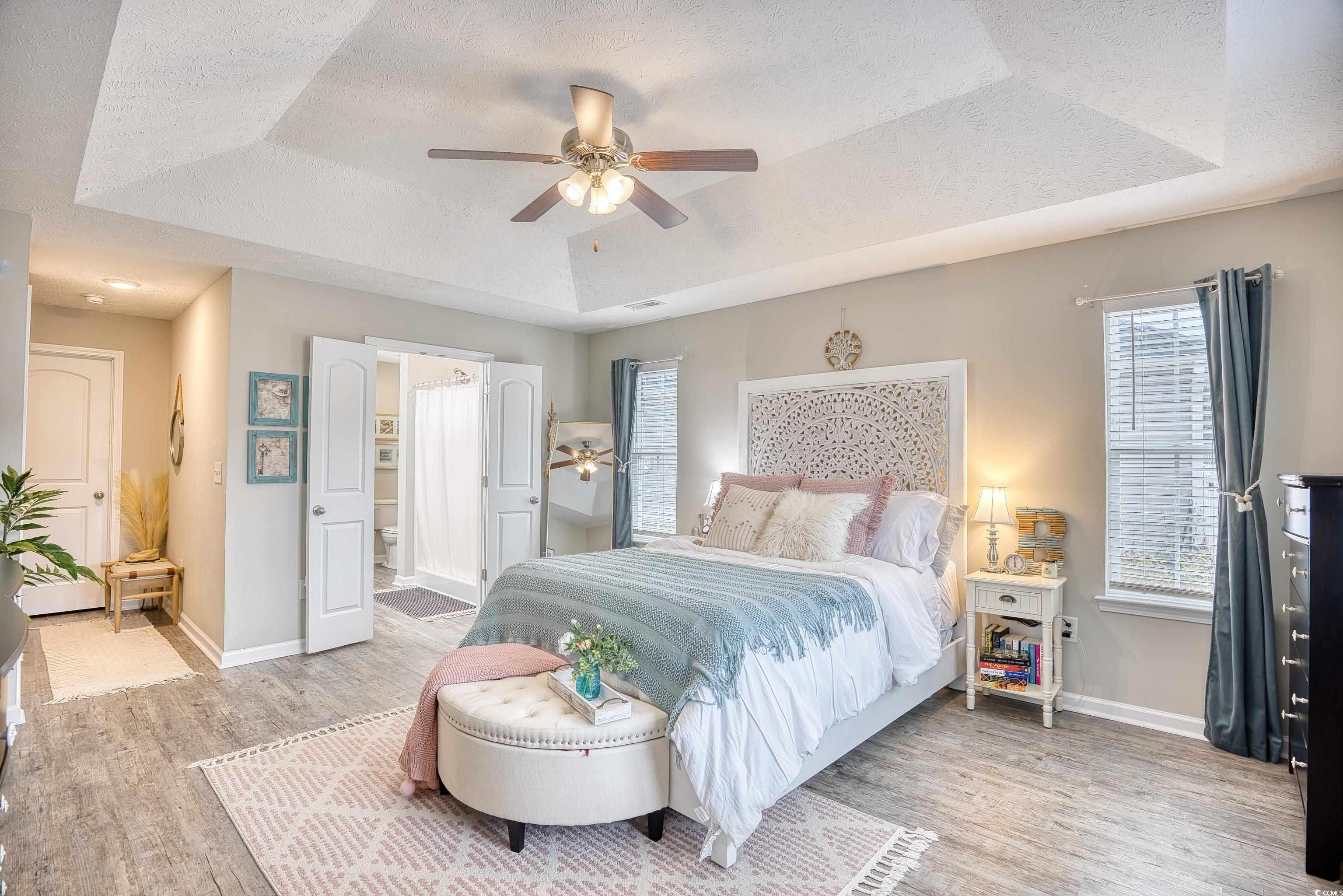520 Hobie Cat Road Myrtle Beach, SC 29588 - Photo 33 of 40 Bedroom featuring ceiling fan, a raised ceiling, c