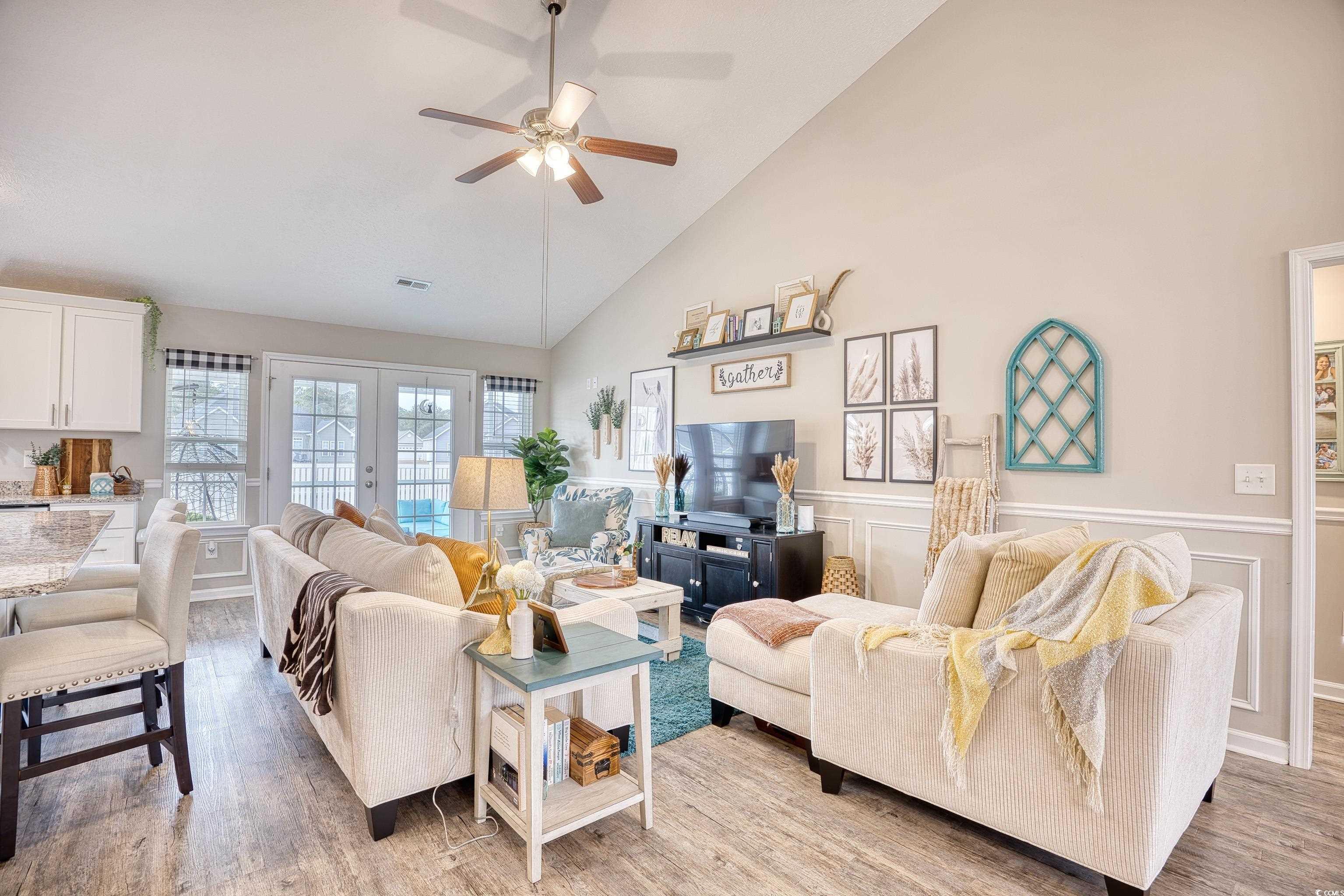 520 Hobie Cat Road Myrtle Beach, SC 29588 - Photo 8 of 40 Living room featuring french doors, high vaulted c