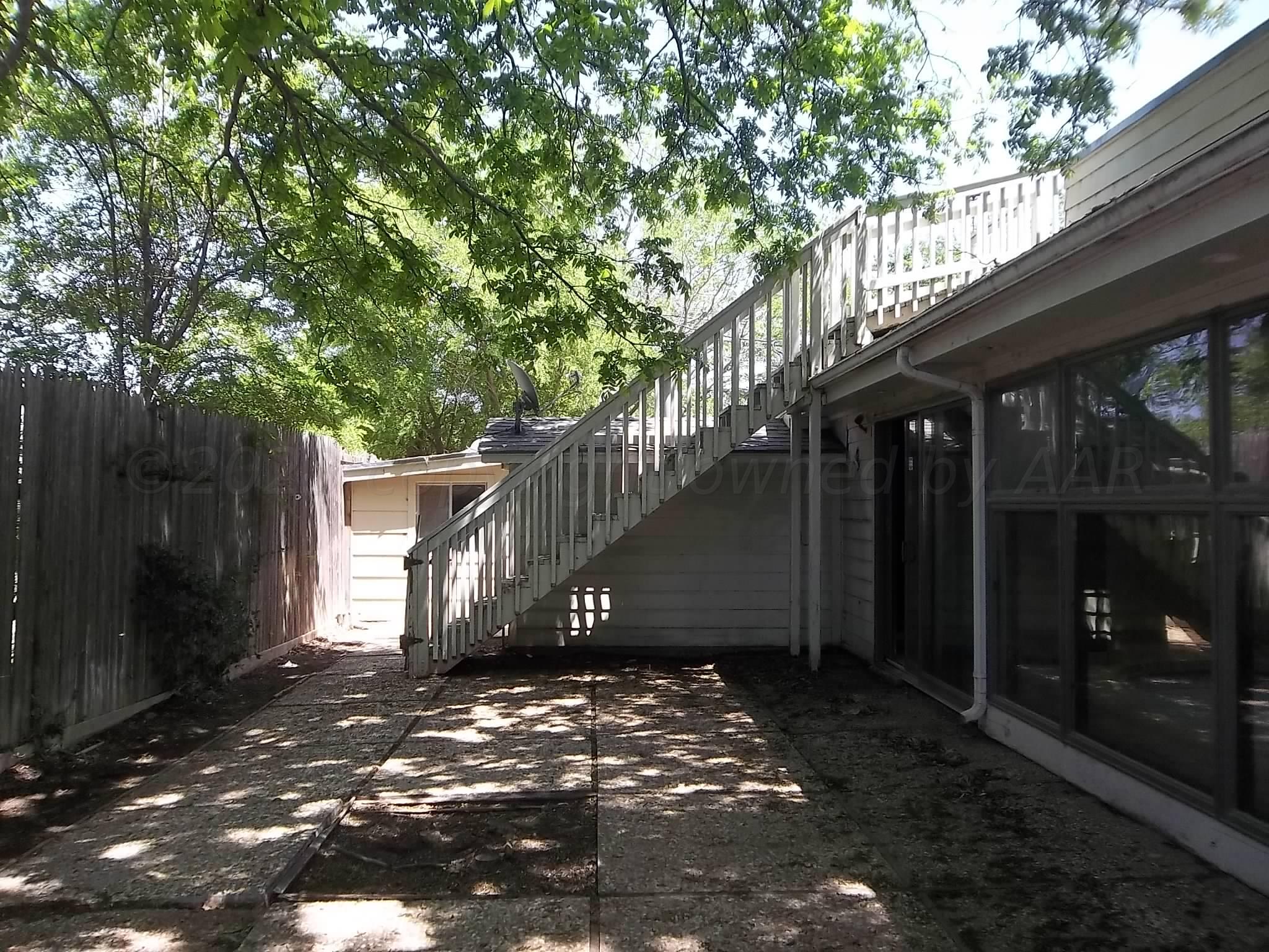 6700 Jameson Road Amarillo, TX 79106 - Photo 7 of 41 a view of a house with a tree
