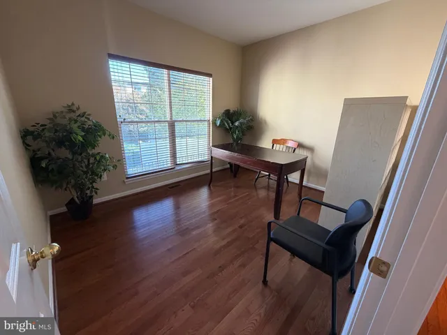 a view of entryway with wooden floor