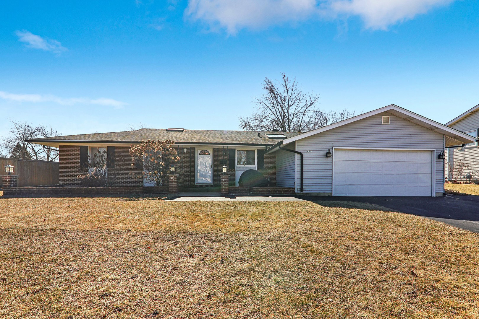 875 West Firestone Drive Hoffman Estates, IL 60192 - Photo 1 of 16 a front view of house with yard and trees in the background