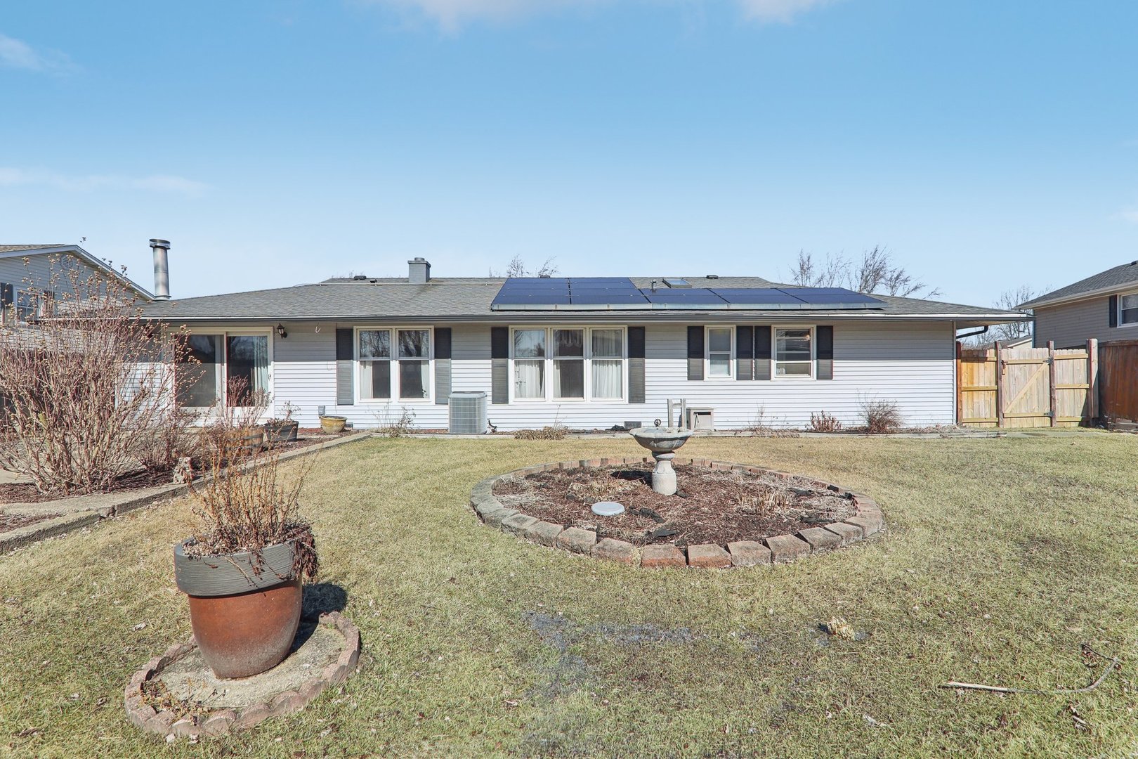 875 West Firestone Drive Hoffman Estates, IL 60192 - Photo 13 of 16 a front view of a house with a yard